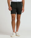 7 Black Chino Shorts 2.0 with white sneakers and shirt hem.