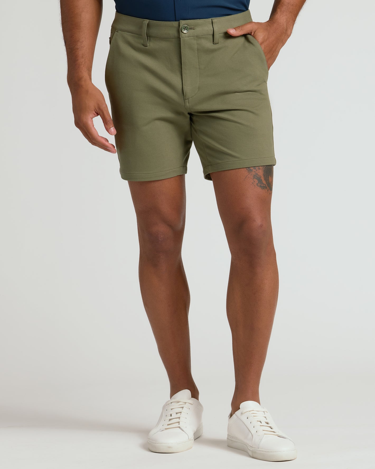 7 Military Green Classic Chino Shorts, tailored fit, with white sneakers.