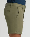 7 Military Green Classic Chino Shorts with side zip pocket, mid-thigh length.