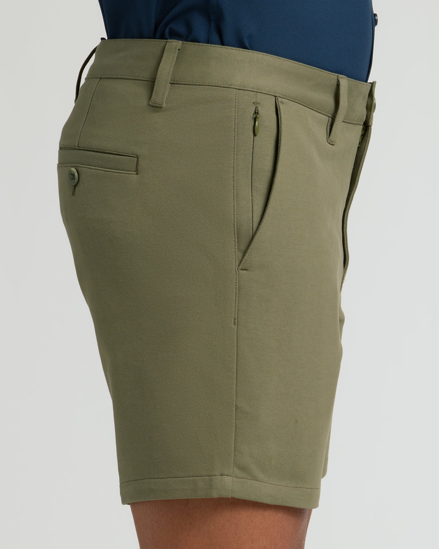 7 Military Green Classic Chino Shorts with side zip pocket, mid-thigh length.