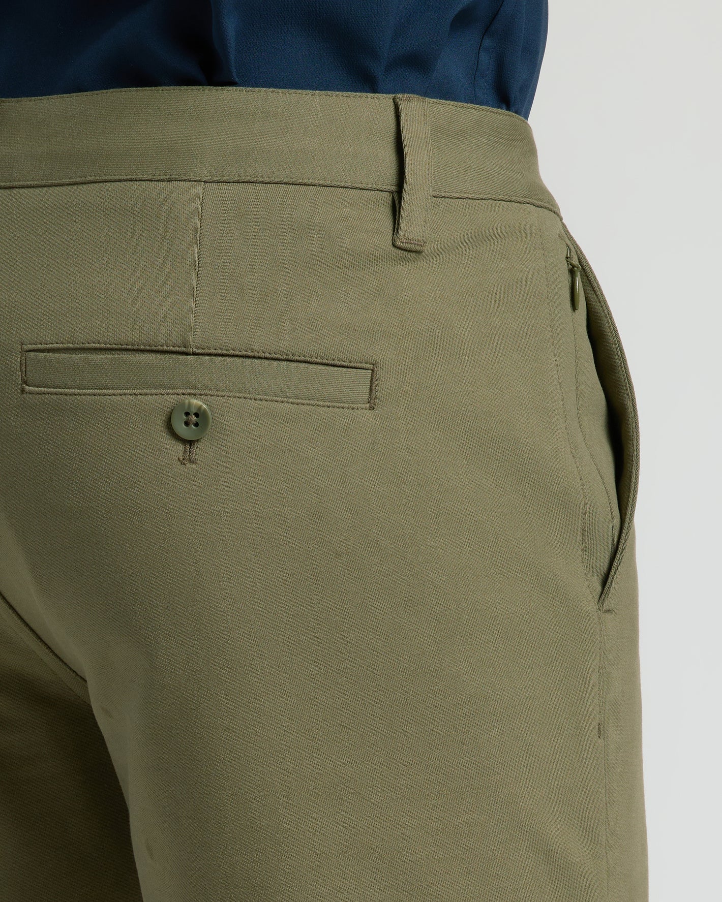 7 Military Green Classic Chino Shorts showcasing belt loop, zippered pocket, and twill texture.