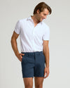 Man wearing 7 Navy Chino Shorts 2.0, looking stylish and relaxed.