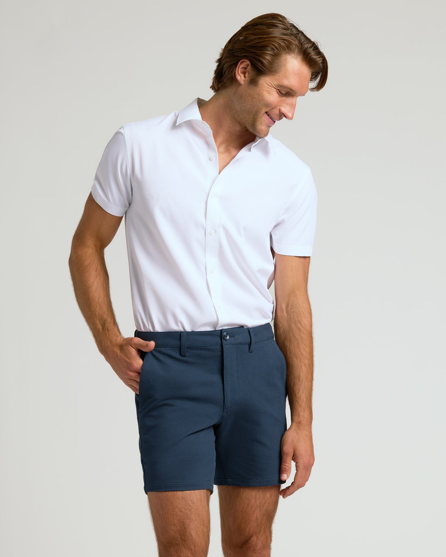 Man wearing 7 Navy Chino Shorts 2.0, looking stylish and relaxed.