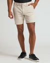 7 Sandstone Chino Shorts with black sneakers, showcasing sleek style.