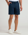 9 Navy & Fiord Linen Shorts 2-Pack with white sneakers, hand in pocket.