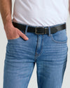 Casual Reversible Stretch Belt in black leather on blue jeans.