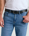 Casual Reversible Stretch Belt on medium-blue jeans, black side visible.
