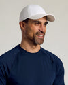 Man wearing White Active Running Cap, showcasing its sleek design and fit.