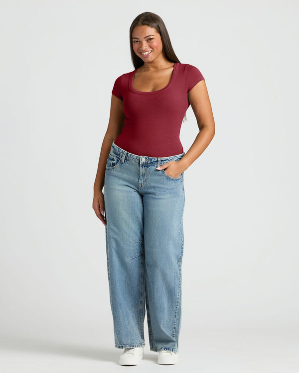 Woman in Womens Dark Maroon Ribbed U-Neck Tee and jeans.