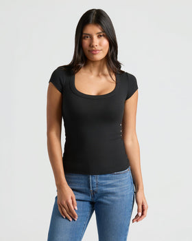 Model wearing Womens Ribbed U-Neck Tee, showcasing its flattering neckline and fit. MODEL_INFO: Sophia is 5'8", wearing a size XS