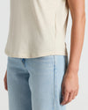 Womens Oatmeal Relaxed Slub V-Neck Tee worn with light-wash jeans.