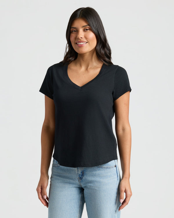 Woman wearing Womens Black Relaxed Slub V-Neck Tee, light-wash jeans. MODEL_INFO: Sophia is 5'8", wearing a size XS 