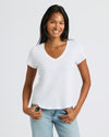 Woman wearing Womens Black & White Relaxed Slub V-Neck Tee, smiling casually.