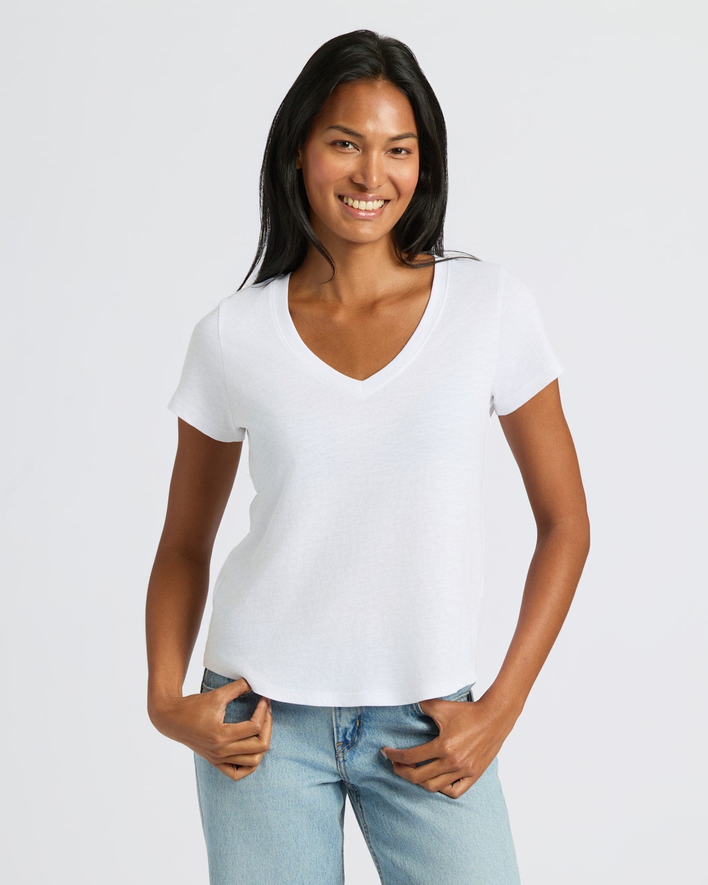 Woman in Womens Navy & White Relaxed Slub V-Neck Tee smiling.