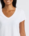 Womens Black & White Relaxed Slub V-Neck Tee, collarbone visible, relaxed smile.