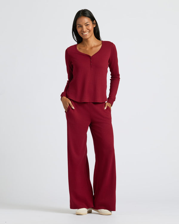 Woman wearing Womens Dark Maroon Waffle Long Sleeve Boxy Henley set.