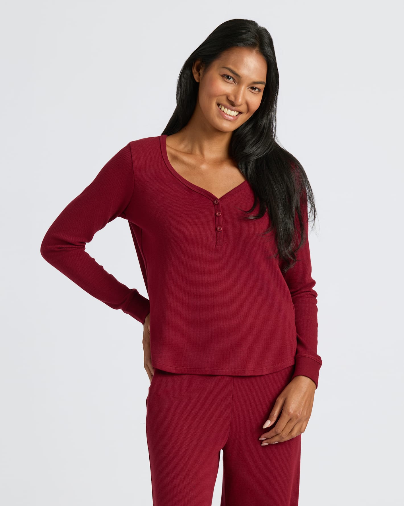 Woman wearing Womens Dark Maroon Waffle Long Sleeve Boxy Henley, smiling.