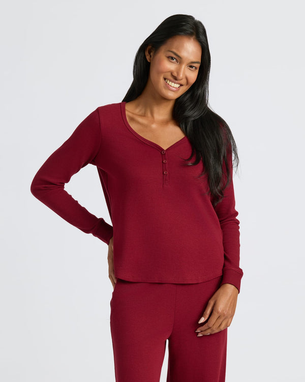 Woman wearing Womens Dark Maroon Waffle Long Sleeve Boxy Henley, smiling. MODEL_INFO: Candy is 5'9", wearing a size S