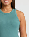 Smiling person wearing the Womens Stormcloud Ribbed High Neck Tank.
