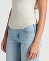Womens Oatmeal Ribbed High Neck Tank 3-Pack shown with light-wash jeans.