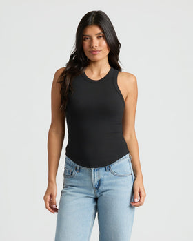 Woman wearing Womens Black Ribbed High Neck Tank 3-Pack with blue jeans. MODEL_INFO: Sophia is 5'8", wearing a size XS
