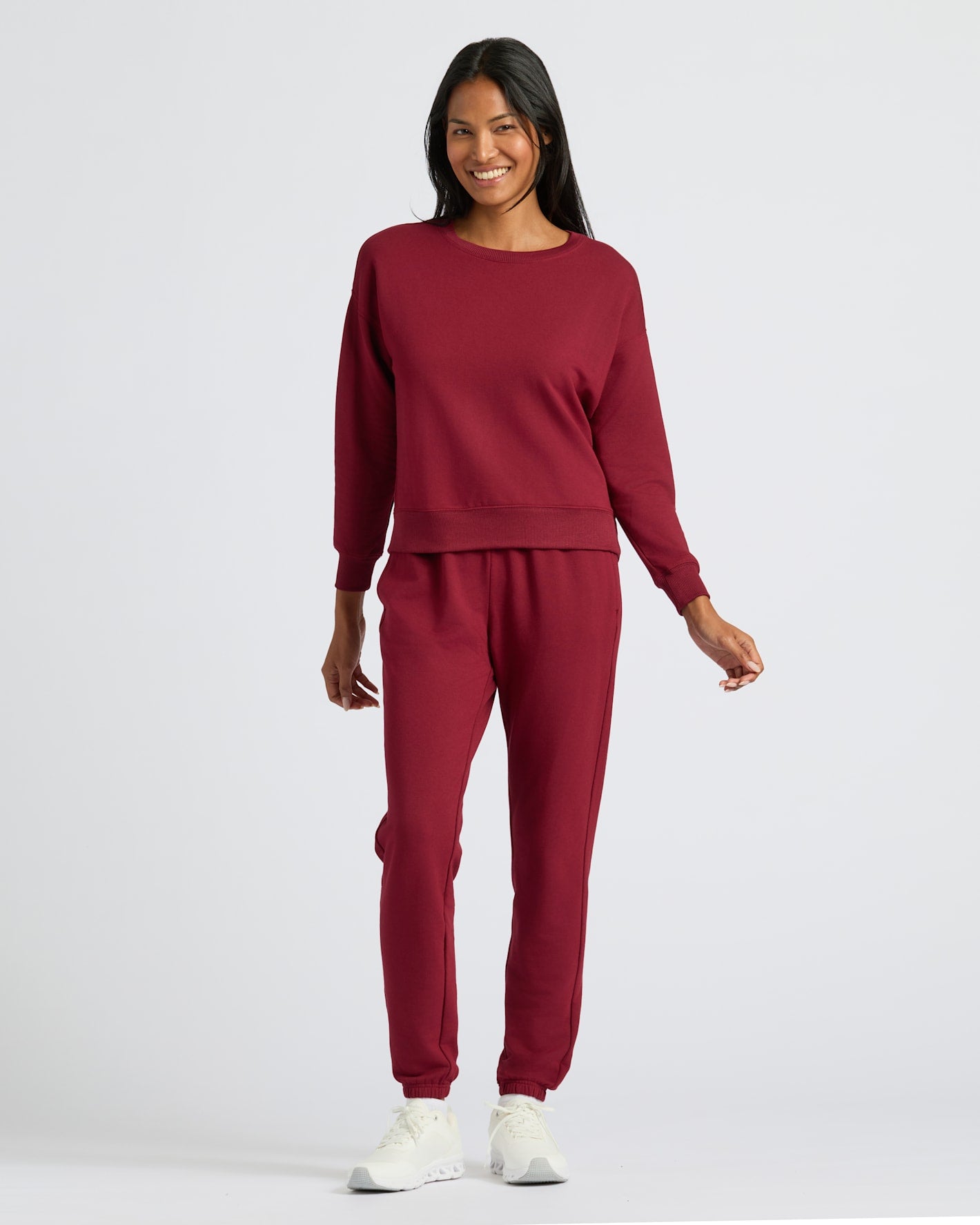 Woman in Womens Dark Maroon Slouch Pullover Crew, casual athleisure style.