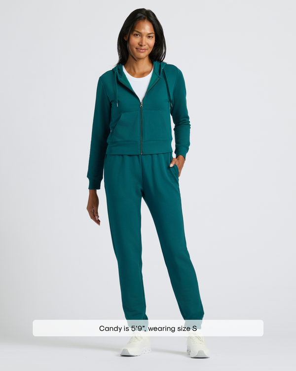 Woman in Womens Deep Emerald Crop Zip Hoodie & Relaxed Jogger.