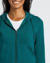 Womens Deep Emerald Crop Zip Hoodie, smiling model, partial face visible.