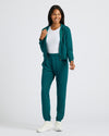 Woman modeling Womens Deep Emerald Crop Zip Hoodie with joggers.