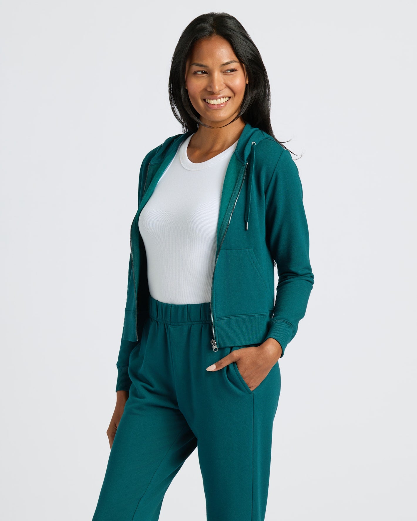 Womens Deep Emerald Crop Zip Hoodie & Relaxed Jogger modeled in studio.