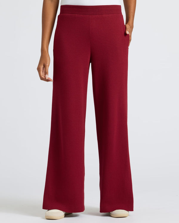 Women's Dark Maroon Waffle Leg Pant modeled, showcasing relaxed fit and pockets.