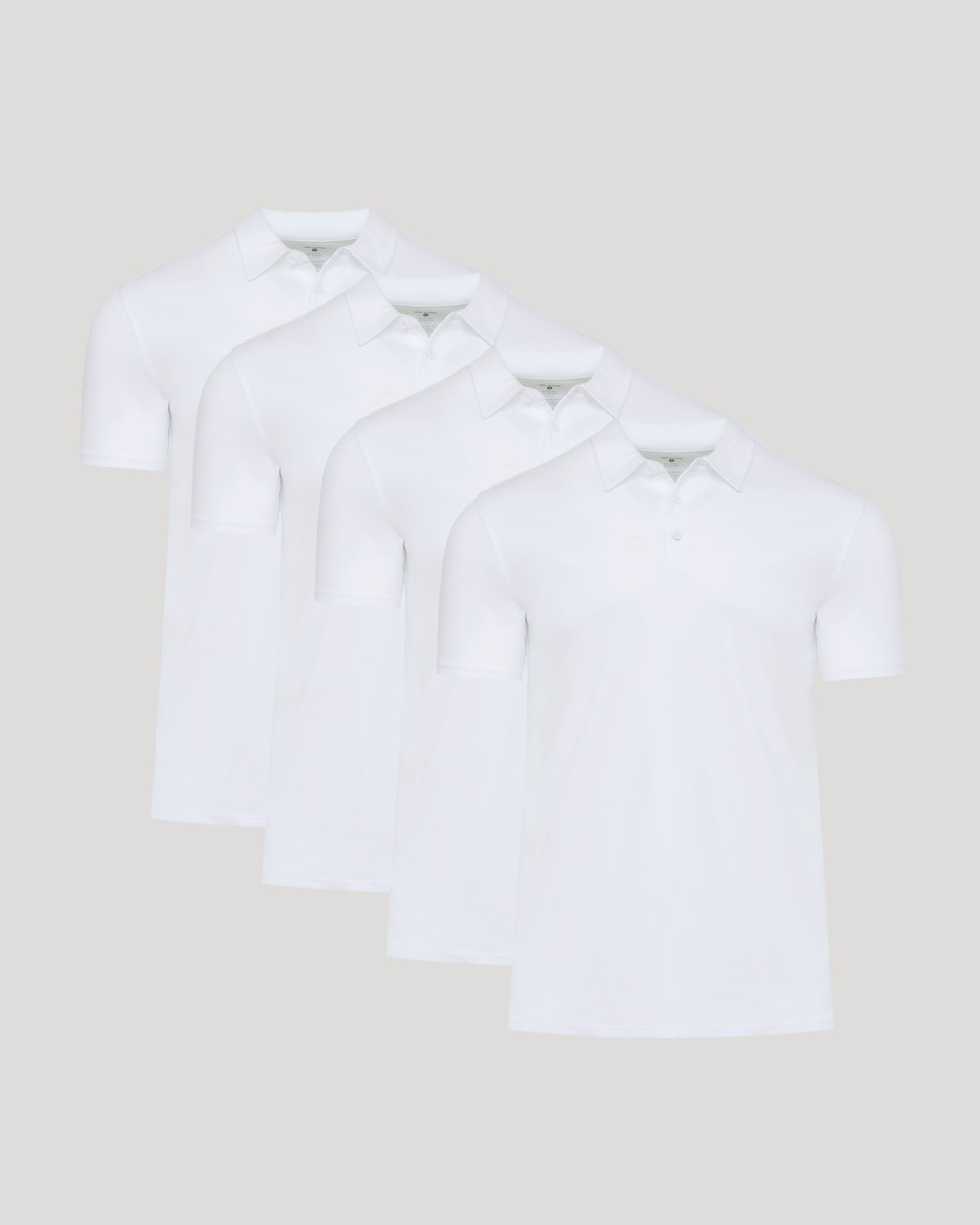 White Premium Pima Polo 4-Pack, arranged in a staggered row.