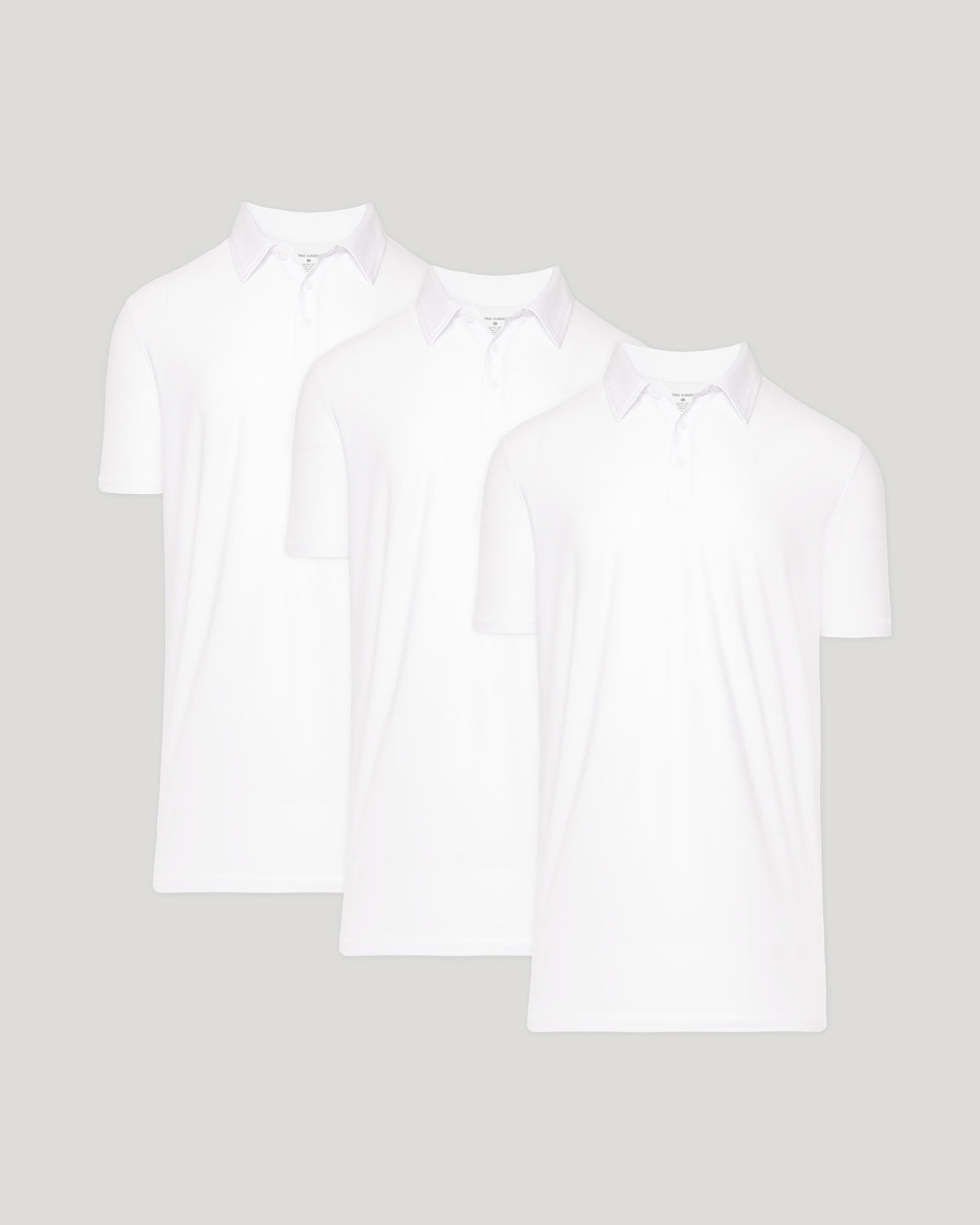 Three white polo shirts displayed side by side featuring the Tall Active Polo - Men's Performance Stretch Polo Shirt - Moisture Wicking Athletic Fit design, highlighting their clean and athletic style.