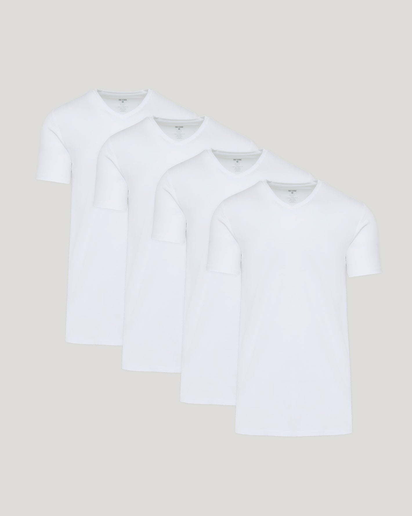 White Tall Premium Pima V-Neck 4-Pack, staggered display of four shirts.