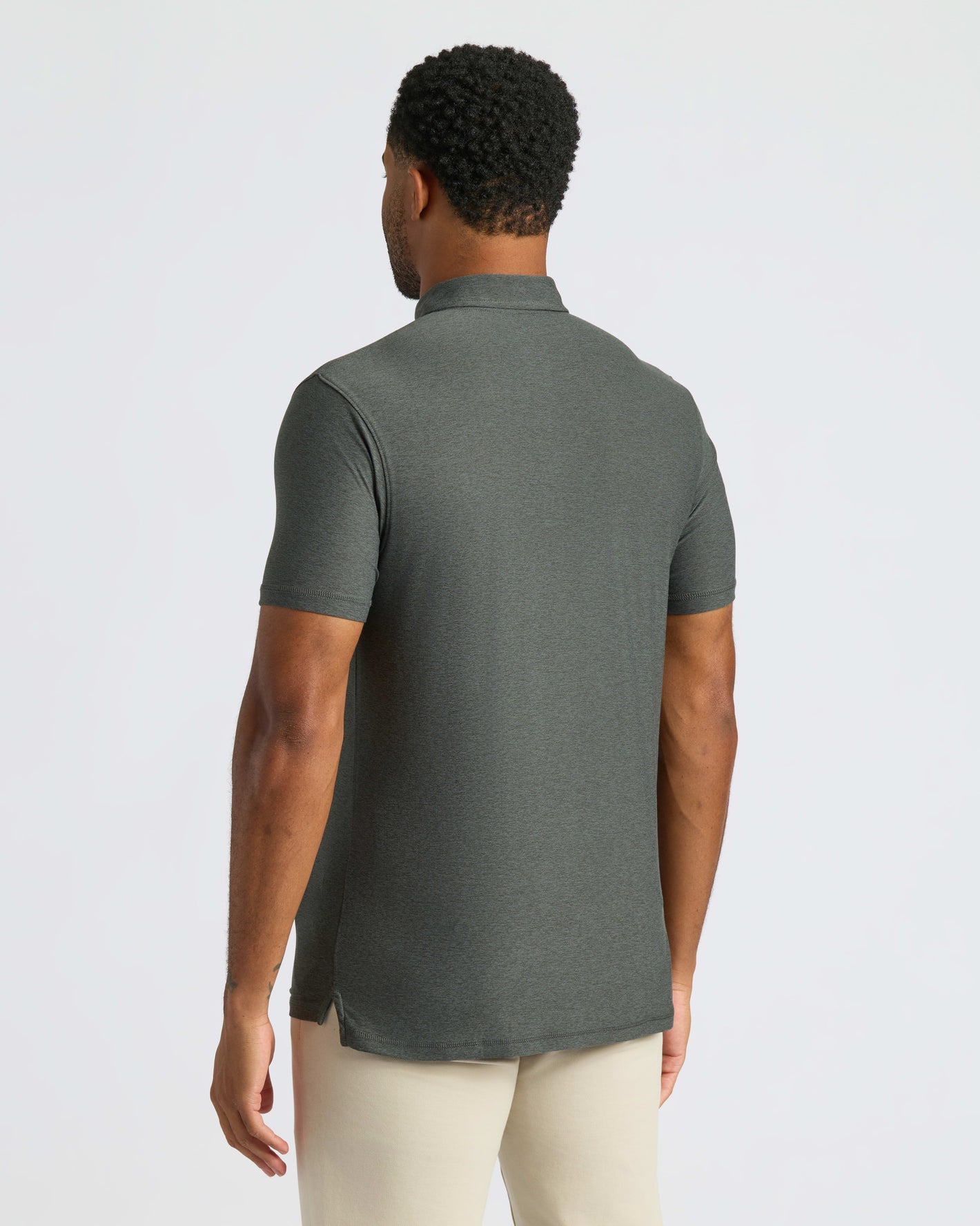 Man wearing True Classic Men’s Classic Short Sleeve Polo Shirt, premium comfort fit.