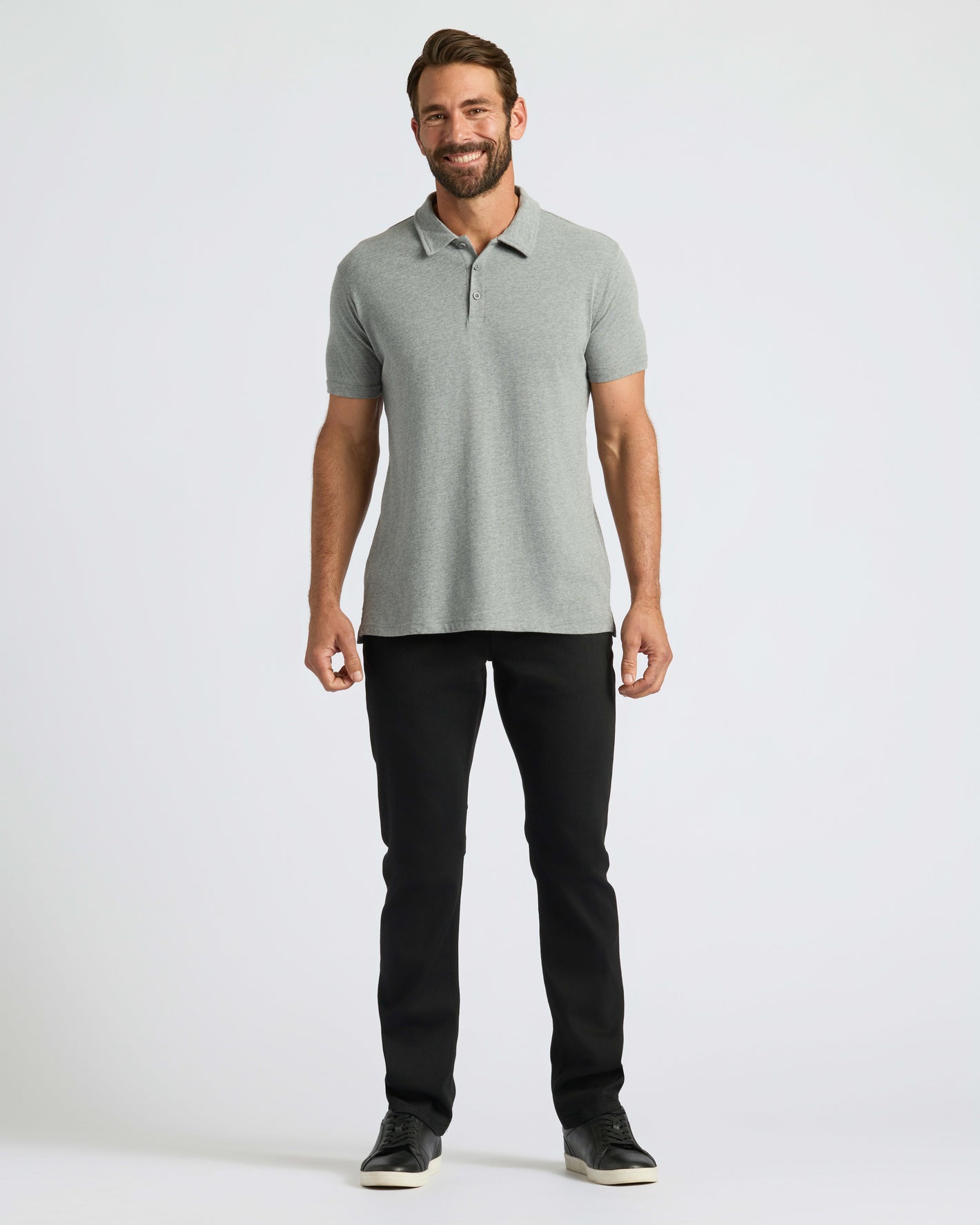 Man wearing True Classic Men’s Classic Short Sleeve Polo Shirt, showcasing versatile style.