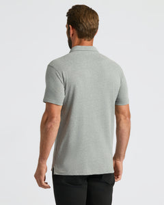 True ClassicBack view of man in True Classic Men’s Classic Short Sleeve Polo.