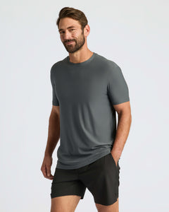 True ClassicMan wearing Classic Polo with shorts, hand in pocket.