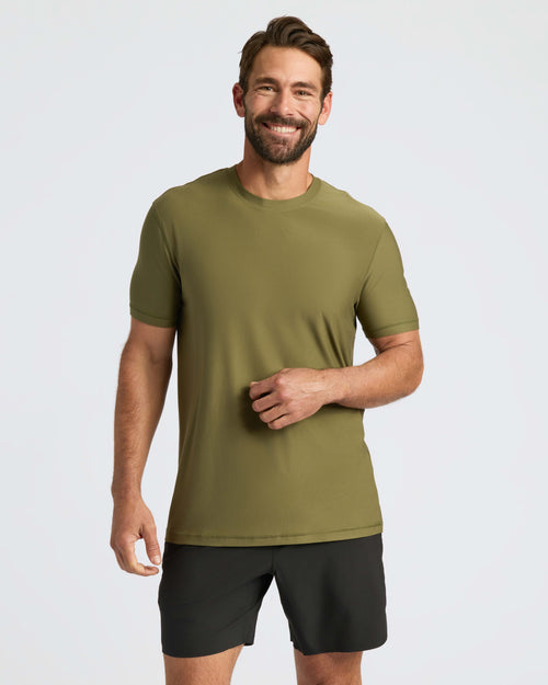 Man in Military Green Active Crew Neck Tee and black shorts.