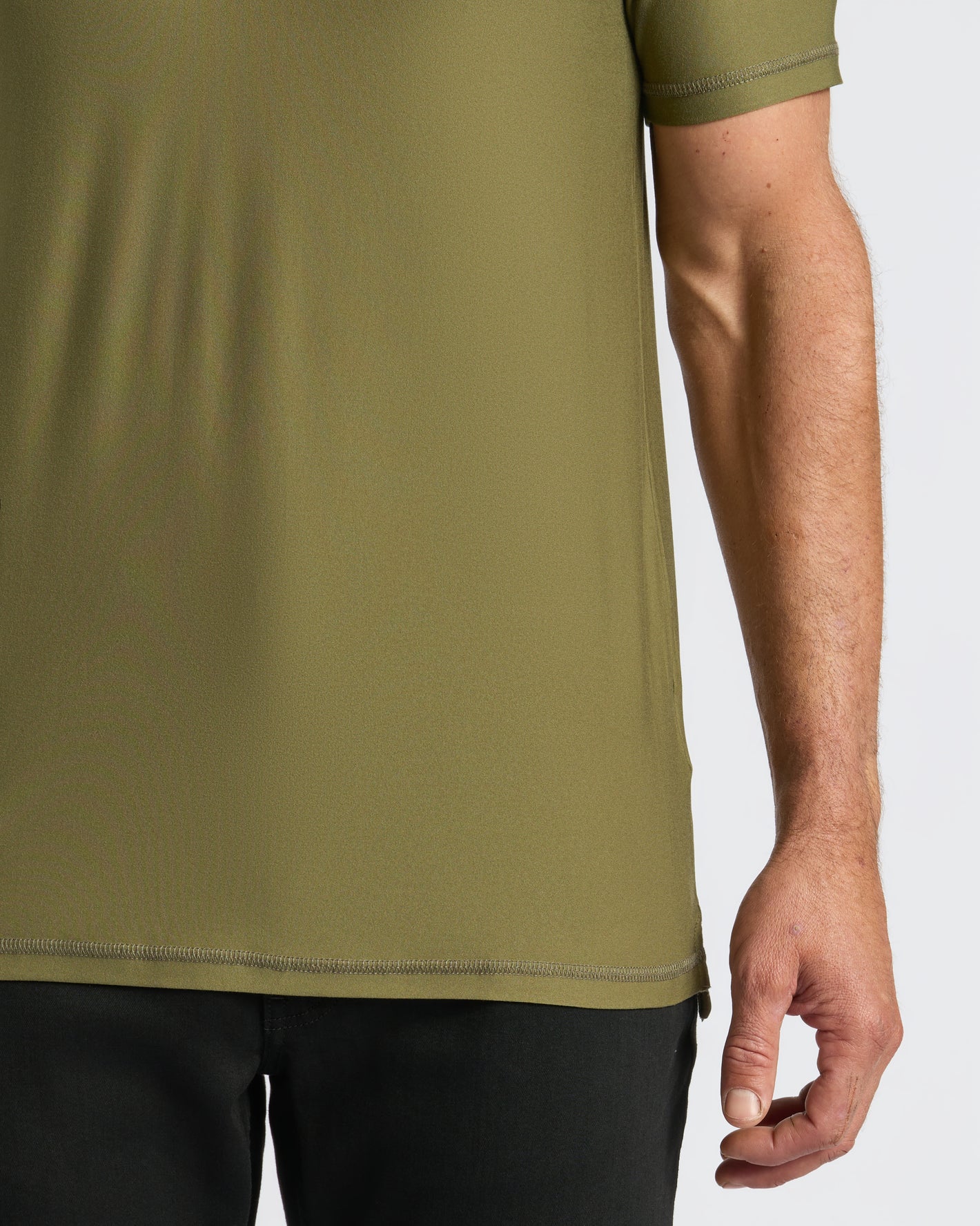 Military Green Active Polo 2.0, showcasing hem stitching and fit.