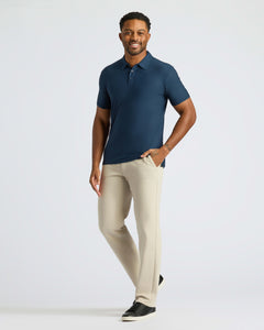 True ClassicNavy Active Polo 2.0 on man with beige pants.