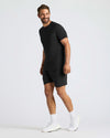 Man in Black Active Mesh Crew 6-Pack, smiling, relaxed pose.
