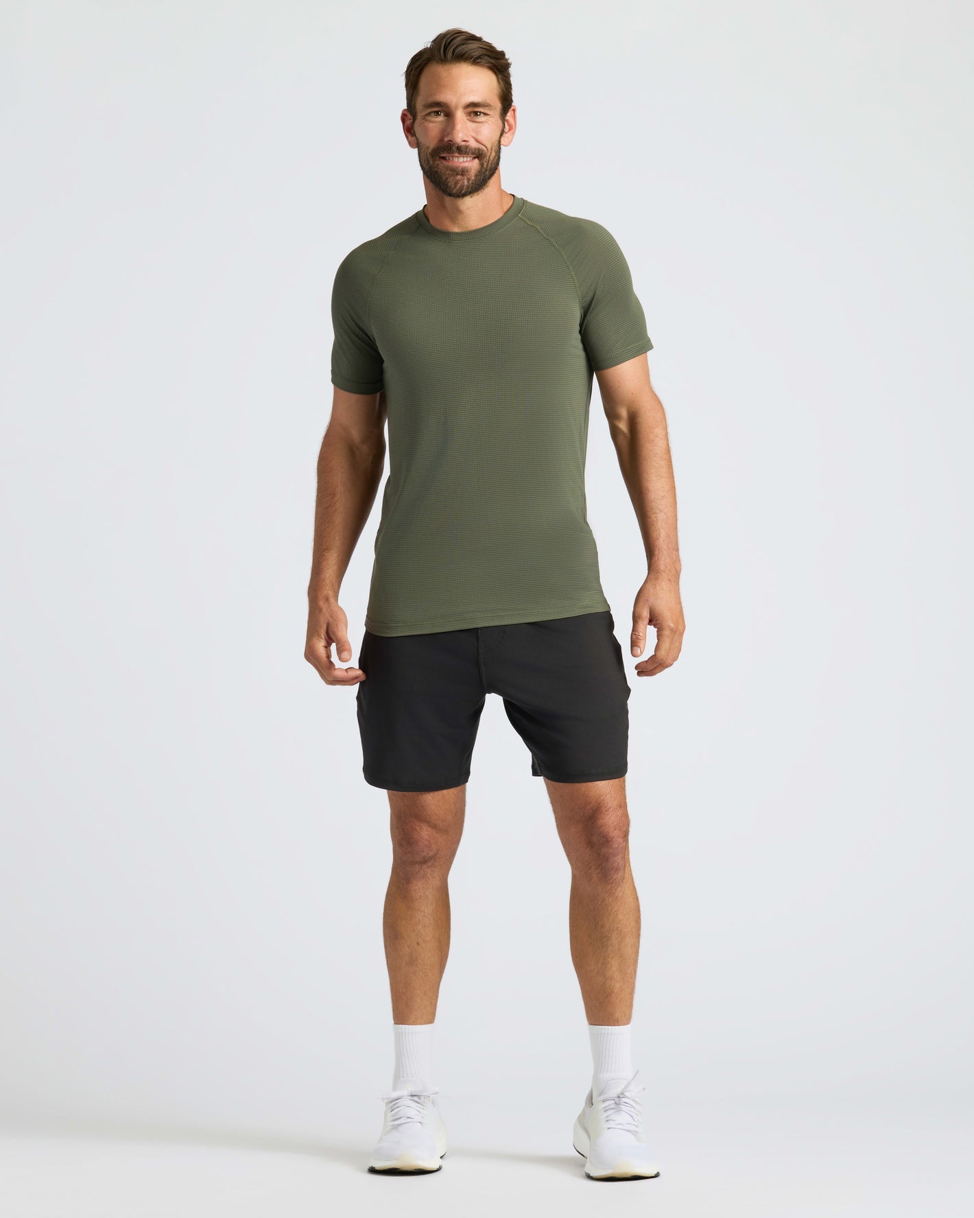 Man wearing Kelp Active Mesh Crew for a sporty look.