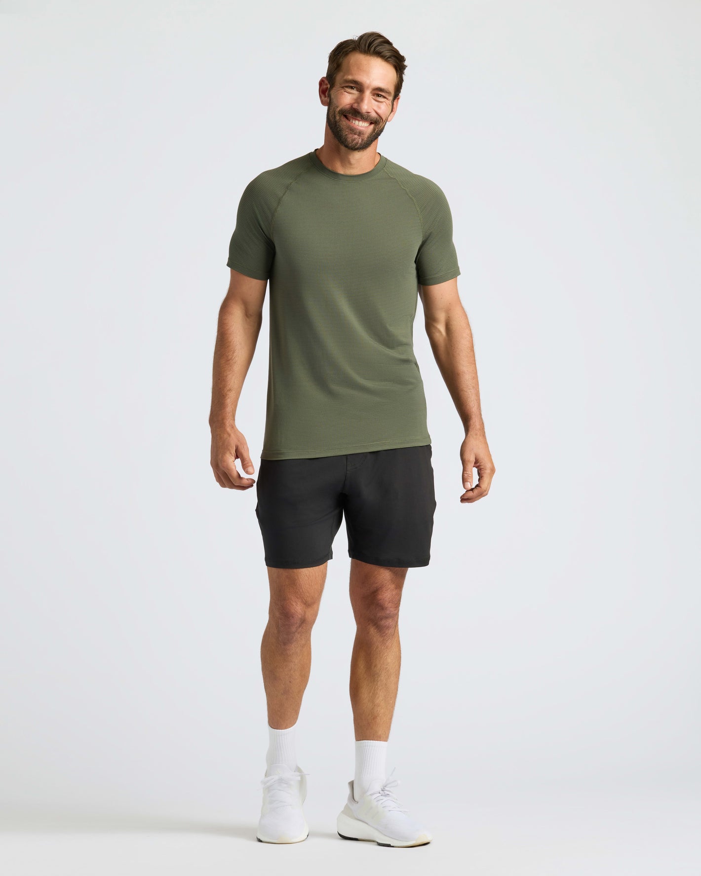 Man modeling Kelp Active Mesh Crew in relaxed pose.