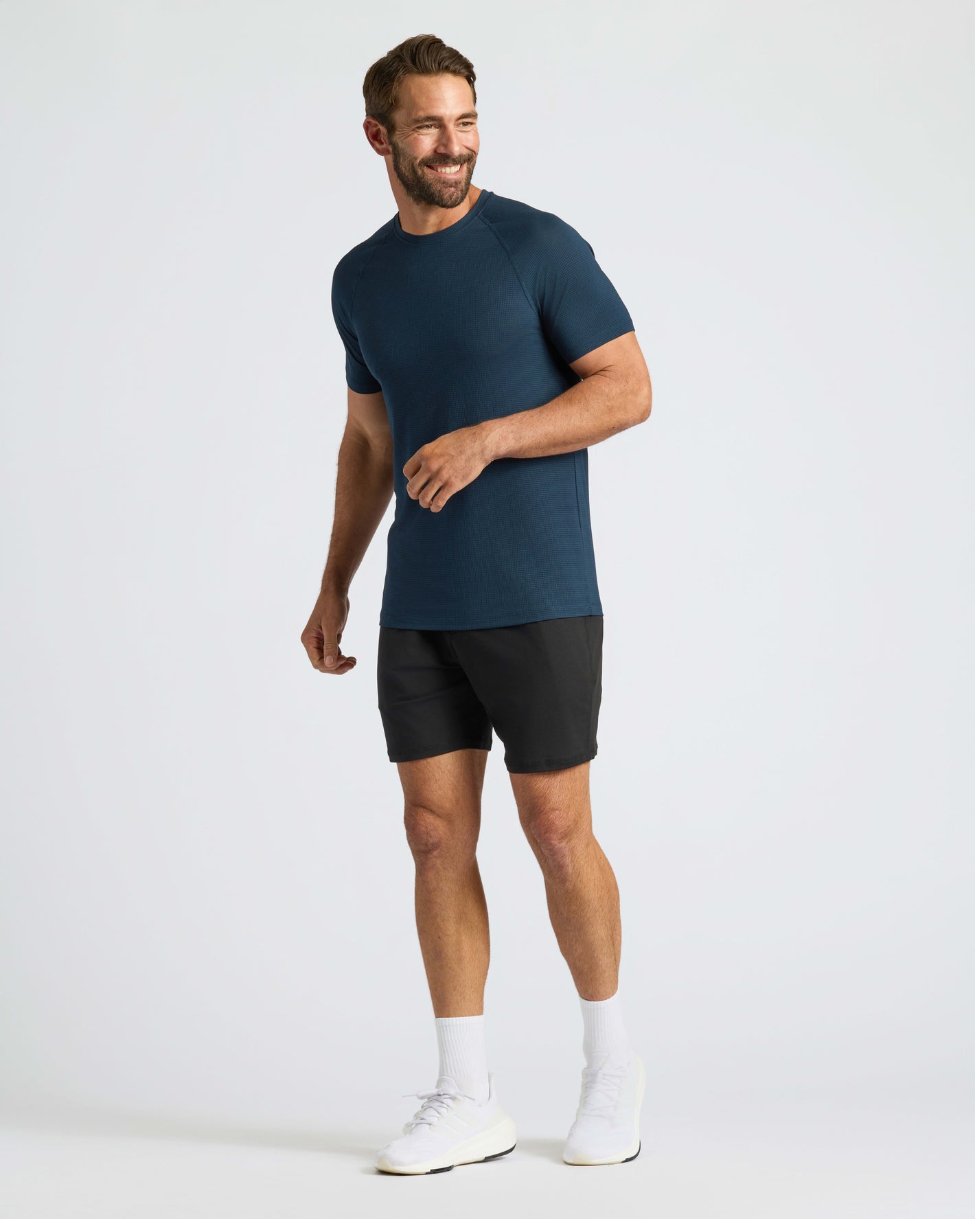 Man in Navy Active Mesh Crew 6-Pack, smiling, in workout attire.