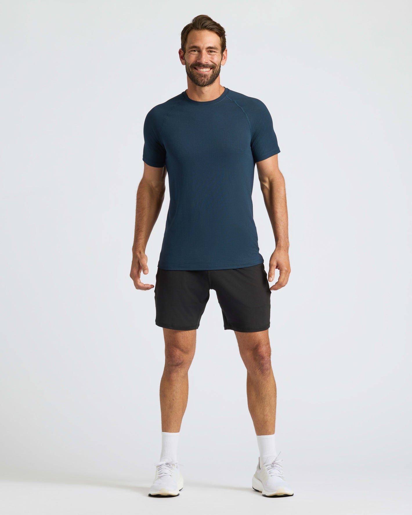 Man wearing Navy Active Mesh Crew 6-Pack shirt, smiling.