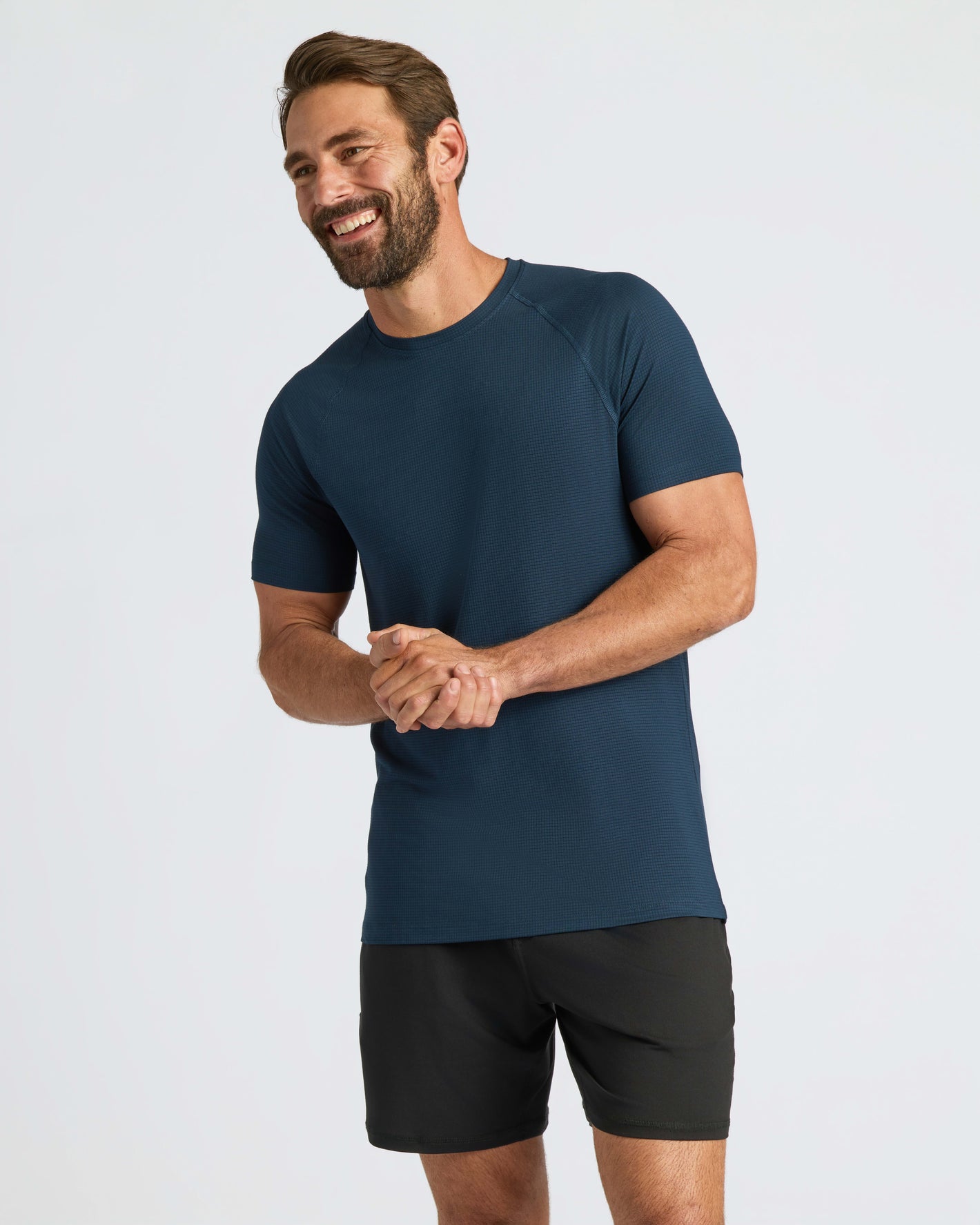 Athletic man wearing Navy Active Mesh Crew 6-Pack tee and shorts.