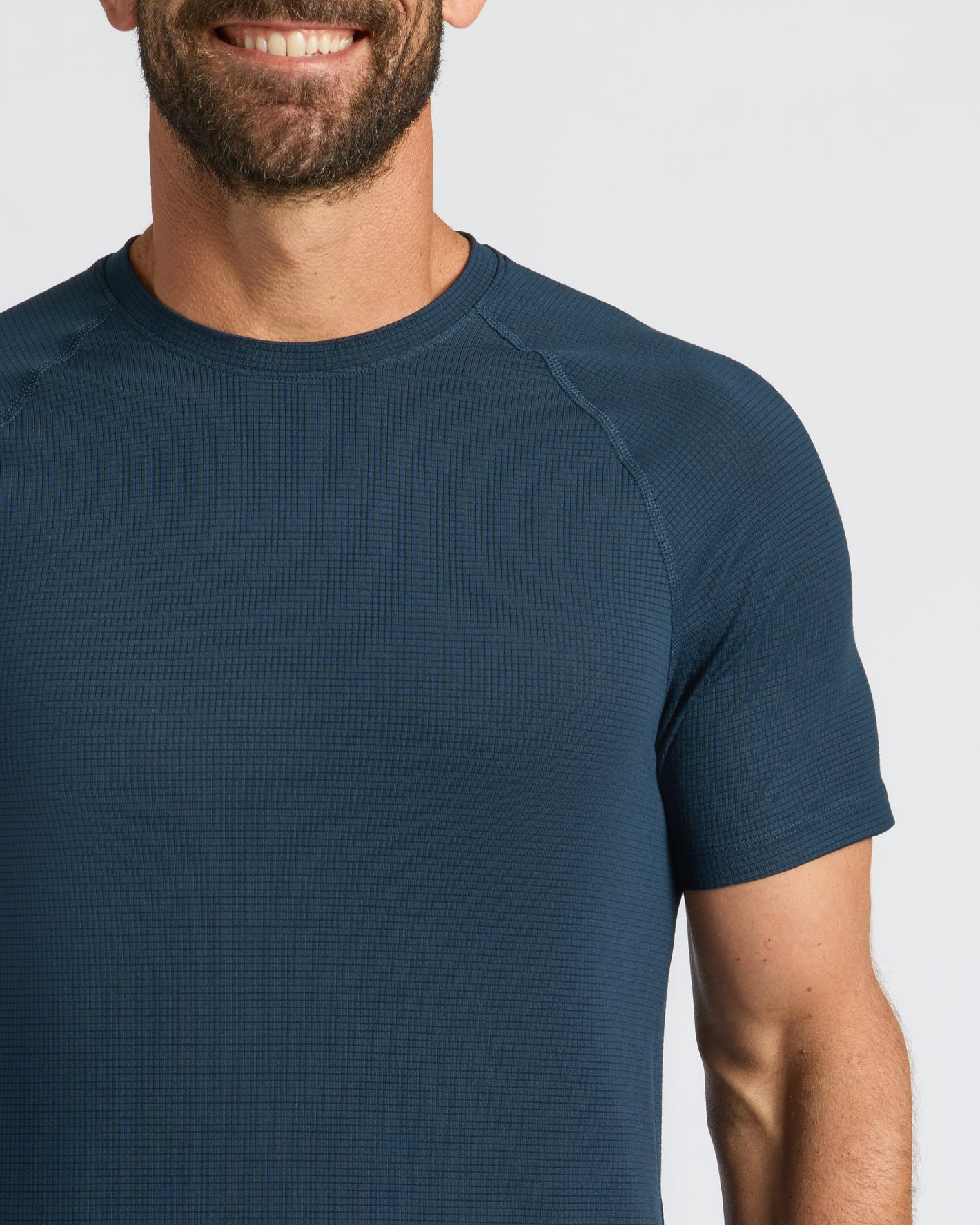 Man in Navy Active Mesh Crew 6-Pack, waffle-textured, short-sleeve T-shirt.