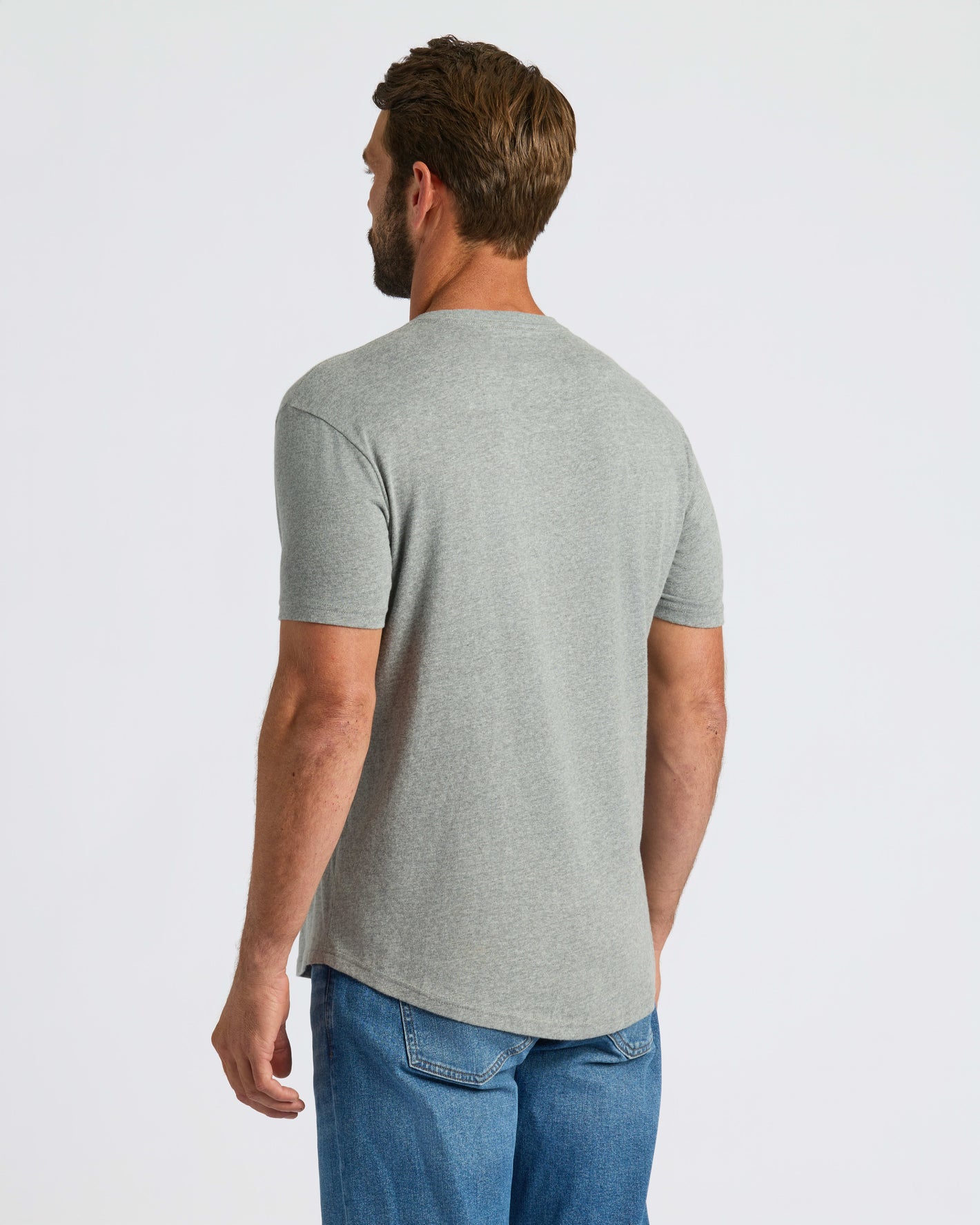 Man wearing Heather Gray Curved Hem Classic Crew Neck T-shirt.