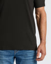 Person wearing All Black Classic V-Neck T-Shirt from 10-Pack.